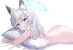  1girl animal_ear_fluff animal_ears ass blue_archive blue_eyes cross_hair_ornament extra_ears face_in_pillow goyain grey_hair hair_ornament halo highres hug looking_at_viewer lying medium_hair mismatched_pupils nude object_hug on_stomach pillow pillow_hug shiroko_(blue_archive) simple_background solo white_background wolf_ears 