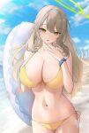  1girl absurdres beach bikini blue_archive blue_sky blurry blurry_background breasts cleavage cloud collarbone day dot_nose green_eyes halo hand_up highres holding holding_innertube innertube large_breasts light_brown_hair long_hair looking_at_viewer n9at navel nonomi_(blue_archive) nonomi_(swimsuit)_(blue_archive) outdoors parted_lips side-tie_bikini_bottom sky solo stomach swimsuit wavy_hair wristband yellow_bikini 