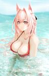  1girl animal_ears arknights bangs bare_shoulders bikini breasts cleavage commentary_request hair_between_eyes hair_intakes highres large_breasts long_hair looking_at_viewer outdoors parted_lips partial_commentary partially_submerged pink_eyes pink_hair pozyomka_(arknights) red_bikini solo sparkle swimsuit water wolf_ears yokaze_(yokajie) 