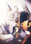  1girl ahoge animal_ears anti-materiel_rifle barrett_m82 black_sailor_collar blue_archive commentary_request ear_protection film_grain fox_ears green_eyes gun halo highres holding holding_weapon looking_through_scope neckerchief otogi_(blue_archive) red_neckerchief rifle sailor_collar school_uniform scope serafuku sniper_rifle solo tactical_school_uniform ula_ula00 upper_body weapon 
