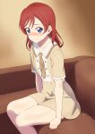  1girl absurdres alternate_hairstyle bare_legs blue_eyes blush clinging couch embarrassed hair_down highres long_hair looking_at_viewer love_live! love_live!_superstar!! nervous on_couch red_hair school_uniform solo thighs wavy_mouth yoneme_mei zanpon 