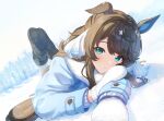  1girl :o animal_ears ankle_boots aqua_eyes bangs black_footwear blue_coat blush boots brown_hair coat daring_tact_(umamusume) day fur-trimmed_boots fur-trimmed_coat fur_trim highres horse_ears horse_girl horse_tail horseshoe kashmir_0808 long_hair long_sleeves looking_at_viewer lying on_ground on_stomach outdoors parted_lips snow solo swept_bangs tail umamusume white_mittens winter 