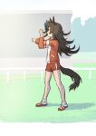  1girl animal_ears blue_headwear brown_hair commentary_request cross-body_stretch day full_body hat highres horse_ears horse_girl horse_tail jacket long_hair long_sleeves nametake outdoors red_jacket red_shorts rice_shower_(umamusume) shoes shorts sneakers socks solo standing stretching tail track_jacket umamusume white_socks 