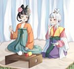 2girls black_hair breasts chinese_clothes commentary_request cup eye_contact flower food fruit grapes green_eyes hair_flower hair_horns hair_ornament high-waist_skirt highres holding holding_cup japan_(kuroussa) kuroussa looking_at_another mole mole_on_breast multiple_girls orange_hanfu original personification purple_skirt red_eyes sitting skirt tang_dynasty_(kuroussa) teapot wariza white_hair 