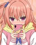  1girl blue_bow blue_bowtie blue_scrunchie blush bow bowtie cellphone commentary_request covering_own_mouth embarrassed eyes_visible_through_hair furrowed_brow hair_between_eyes hair_ornament hair_scrunchie hands_up highres holding holding_phone inaba_meguru jacket kumaron letterman_jacket long_hair looking_at_viewer nose_blush one_side_up orange_background orange_hair phone pink_jacket red_eyes sanoba_witch scarf scrunchie sidelocks simple_background sleeves_past_wrists smartphone solo upper_body white_sleeves yellow_scarf 