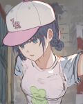  1girl :p alternate_costume baseball_cap blue_eyes blue_hair blue_shirt breasts chase_my_ideal_idol!_(project_sekai) closed_mouth clover_print hat highres indoors kabedon_on_viewer kiritani_haruka large_breasts official_alternate_hairstyle pink_hat project_sekai shirt short_hair short_sleeves sketch solo sxz3a tongue tongue_out two-tone_hat two-tone_shirt upper_body white_hat white_shirt 
