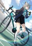  1girl absurdres animal_ears bicycle black_shoes black_skirt blue_archive blue_eyes blue_halo blue_jacket blue_scarf blue_sky blush breasts cloud cloudy_sky commentary cross cross_hair_ornament dutch_angle extra_ears full_body gloves green_gloves grey_hair hair_ornament halo highres inverted_cross jacket lens_flare long_sleeves looking_at_viewer medium_breasts medium_hair mismatched_pupils open_clothes open_jacket s11nq scarf shiroko_(blue_archive) shirt shoes skirt sky socks solo white_shirt white_socks wolf_ears wolf_girl 