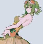  1girl absurdres bare_shoulders breasts dress from_side goggles goggles_on_head green_dress green_hair grey_background gumi headset highres looking_at_viewer nail_polish orange_dress orange_nails parted_lips short_hair_with_long_locks sidelocks simple_background solo strapless strapless_dress torishima_(oshiritorishima) vocaloid 