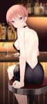  1girl absurdres arm_on_table arm_support back back_cutout bangs bar_(place) bare_back bare_shoulders black_dress blue_eyes blush breasts closed_mouth clothing_cutout cocktail_glass cup dress drink drinking_glass earrings eyelashes from_behind go-toubun_no_hanayome hair_between_eyes highres indoors jewelry large_breasts legs light_brown_hair looking_at_viewer looking_back nakano_ichika no_bra profnote short_hair sideboob single_sidelock smile solo stud_earrings 