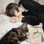  1boy black_hair black_jacket brown_eyes cat collared_shirt given highres jacket kio3o long_sleeves looking_at_viewer lying male_focus murata_ugetsu on_bed on_side paper pen shirt short_hair solo white_shirt 