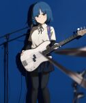  1girl bangs bass_guitar black_pantyhose black_ribbon blue_background blue_hair blue_skirt bocchi_the_rock! closed_mouth feet_out_of_frame fender_precision_bass highres hinami047 holding holding_instrument instrument looking_at_viewer mole mole_under_eye neck_ribbon pantyhose ribbon school_uniform shadow shirt short_hair short_sleeves skirt solo standing white_shirt yamada_ryou yellow_eyes 