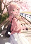  1girl absurdres backpack bag bangs blush braid bush camera cherry_blossoms commentary cowboy_shot day fence grass green_eyes hair_over_shoulder highres holding holding_bag holding_camera hood hooded_sweater light_brown_hair long_sleeevs looking_at_viewer open_mouth original outdoors pink_sweater river senri_(senri_sen) sidelocks skirt smile solo standing sweater symbol-only_commentary tree twin_braids viewfinder white_skirt 
