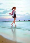  1girl barefoot beach brown_eyes brown_hair closed_mouth cloud commentary day full_body highres kantai_collection long_hair long_sleeves nito_(nshtntr) outdoors pleated_skirt ryuujou_(kancolle) shirt skirt sky solo suspender_skirt suspenders twintails walking water white_shirt 