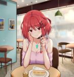  1girl absurdres backon bare_shoulders blurry blurry_background blush breasts cake chair cleavage collarbone commentary_request food fork hair_ornament hairclip highres holding holding_fork indoors looking_at_viewer off-shoulder_shirt off_shoulder pink_shirt pyra_(xenoblade) red_eyes red_hair shirt short_hair short_sleeves smile solo table upper_body xenoblade_chronicles_(series) xenoblade_chronicles_2 