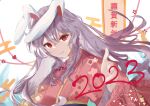  1girl alternate_costume animal_ears bangs closed_mouth commentary_request floral_print highres japanese_clothes kimono long_hair looking_at_viewer purple_hair rabbit_ears rabbit_girl red_eyes red_kimono reisen_udongein_inaba smile solo touhou tsukishiro upper_body 
