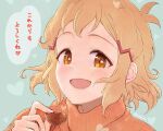  1girl bangs brown_hair chocolate commentary food hair_ornament hairclip heart holding holding_food looking_at_viewer open_mouth orange_eyes orange_shirt portrait senki_zesshou_symphogear shirt short_hair smile solo tachibana_hibiki_(symphogear) translated turtleneck twitter_username unyon valentine 