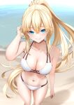  1girl beach bikini blonde_hair blue_eyes blue_sky breasts chinese_commentary cleavage cloud commentary_request day defaultkavy feet_out_of_frame from_above highres horizon large_breasts looking_at_viewer ocean original outdoors ponytail sky solo standing swimsuit white_bikini 