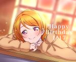  1girl arm_rest blurry blurry_background brown_coat brown_hair coat curly_hair desk happy_birthday head_rest highres koizumi_hanayo long_sleeves looking_at_viewer love_live! mei_(d9en03iu3cwlafx) on_desk purple_eyes school_desk single_sidelock smile sparkle 