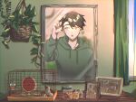  1boy animal bangs black_hair bottle cage commentary_request container curtains day drawstring green_hoodie hair_between_eyes hamster hamster_wheel hand_in_own_hair hanging_plant highres hood hood_down hoodie indoors jar kagerou_project leaf long_sleeves looking_at_mirror looking_to_the_side male_focus mekakucity_actors mirror mokemoke_chan open_mouth pet_food photo_(object) picture_frame plant portrait potted_plant seto_kousuke short_hair solo upper_body window yellow_eyes 