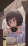  1girl bangs black-framed_eyewear black_hair blue_eyes blue_shirt blurry blurry_foreground bowl chopsticks commentary_request cup depth_of_field drinking_glass eating food glasses highres holding holding_bowl holding_chopsticks indoors long_sleeves looking_away mimikaki_(men_bow) multicolored_hair noodles original puffy_long_sleeves puffy_sleeves purple_hair shirt solo two-tone_hair water 