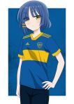  1girl asymmetrical_bangs blue_hair blue_pants blue_shirt bocchi_the_rock! club_atletico_boca_juniors eyes_visible_through_hair hair_ornament hair_over_one_eye hand_on_own_hip highres pale_skin pants riokasen shirt short_hair soccer_uniform solo sportswear yamada_ryo yellow_eyes 