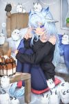  1girl bed bird blue_eyes blue_hair cake food highres indie_virtual_youtuber long_hair looking_at_viewer lunarisbloom mikazuki_silvi off_shoulder owl owl_ears owl_girl pants sweater sweatpants virtual_youtuber 