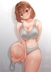  1girl absurdres against_wall bare_shoulders blush breasts brown_eyes brown_hair cleavage closed_mouth collarbone commentary_request cowboy_shot curvy furrowed_brow grey_panties grey_socks grey_sports_bra head_tilt highres huge_breasts looking_at_viewer navel no_shoes original paid_reward_available panties sak1023 shadow shiny_skin short_hair socks solo sports_bra standing standing_on_one_leg stomach tan tanlines thick_thighs thighs underwear underwear_only 
