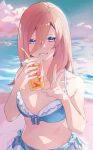  1girl bare_shoulders beach bikini blue_bikini blue_eyes breasts cleavage cup disposable_cup drink front-tie_bikini_top front-tie_top go-toubun_no_hanayome hair_between_eyes hands_up highres holding holding_drink large_breasts long_hair looking_at_viewer nakano_miku ocean outdoors red_hair side-tie_bikini_bottom sky smile solo swimsuit v valentine_(02140314c) 