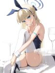  1girl absurdres animal_ears bare_shoulders blonde_hair blue_archive blue_eyes blue_leotard braid breasts cup detached_collar drinking_glass fake_animal_ears halo hidulume high_heels highres leotard long_hair looking_at_viewer medium_breasts multicolored_hair official_alternate_costume playboy_bunny rabbit_ears strapless strapless_leotard streaked_hair thighhighs thighs toki_(blue_archive) toki_(bunny)_(blue_archive) very_long_hair white_thighhighs wine_glass wrist_cuffs 