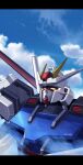  blue_sky cloud cloudy_sky commentary day english_commentary g.yamamoto gundam gundam_seed highres letterboxed looking_up mecha mobile_suit no_humans robot science_fiction sky solo strike_gundam v-fin yellow_eyes 