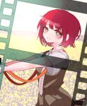  1girl :d blurry blurry_background blush bob_cut breasts bright_pupils brown_dress brown_eyes camera commentary danganronpa_(series) danganronpa_2:_goodbye_despair depth_of_field dress dress_shirt eyelashes field film_strip freckles from_side highres holding holding_camera koizumi_mahiru komatta_nagito looking_at_viewer looking_to_the_side messy_hair necktie outdoors outstretched_arms parted_lips pinafore_dress plaid_necktie red_hair red_necktie school_uniform shirt short_hair short_sleeves sleeveless sleeveless_dress small_breasts smile solo standing strap two-tone_necktie upper_body very_short_hair white_necktie white_pupils white_shirt wind 