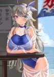  1girl ahoge blue_one-piece_swimsuit blue_sky blush breasts cloud cloudy_sky grey_eyes grey_hair highres kantai_collection large_breasts long_hair looking_at_viewer mayura_(lucadia) ocean one-piece_swimsuit sarong sky smile solo swimsuit table twitter_username washington_(kancolle) 