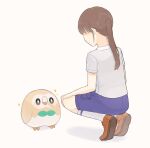  1girl animal animal_focus beak bird blue_shorts bow bowtie brown_feathers brown_hair closed_mouth feather_in_mouth feathers green_bow green_bowtie highres holding holding_feather light_blush long_bangs looking_at_another medium_bangs obscured_eyes orange_footwear owl pocket pokemon pokemon_(creature) ponytail rowlet shirt shorts simple_background smile sparkle squatting t-shirt talons tennis_socks white_background white_feathers white_shirt xhtx 