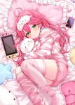  1girl absurdres candy cellphone closed_mouth food green_eyes hair_between_eyes hair_ornament hairclip highres hololive ineka_ka long_sleeves lying mask nintendo_switch phone pillow pink_hair pink_hood pink_shorts pink_thighhighs sakura_miko shirt shorts smartphone smile solo striped striped_shirt stuffed_animal stuffed_cat stuffed_toy thighhighs virtual_youtuber 