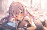 1girl ;d absurdres blush crystal gem hair_ornament hairclip highres hololive hololive_english koseki_bijou long_hair lying maru_ccy moai on_stomach one_eye_closed open_mouth pillow purple_eyes purple_hair smile solo virtual_youtuber wings 