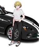  1girl black_car black_pants blonde_hair blue_eyes breasts car collarbone commentary dodge_viper english_commentary full_body grey_shirt hand_on_own_hip highres kaiware leggings looking_at_viewer medium_hair midriff motor_vehicle navel open_mouth original pants shirt shoes short_sleeves sneakers solo sports_car standing white_background white_footwear 