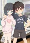  1boy 1girl absurdres black_hair black_shirt blue_eyes blurry blurry_background blush brown_eyes brown_hair brown_shorts closed_mouth collarbone commentary_request crossdressing drawstring feet_out_of_frame grin hand_on_another&#039;s_shoulder heart highres hood hoodie lolicom long_sleeves looking_at_viewer nose_blush original otoko_no_ko photo_background pink_hoodie print_shirt puffy_long_sleeves puffy_sleeves shirt short_hair short_sleeves shorts smile standing t-shirt tomboy 