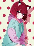  1girl animal_ears arima_kana blue_hoodie bob_cut bokutaaaa cat_ears cat_girl closed_mouth highres hood hoodie inverted_bob looking_at_viewer oshi_no_ko polka_dot polka_dot_background red_eyes red_hair short_hair sitting solo 