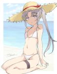  1girl akitsushima_(kancolle) barefoot beach bikini blue_sky breasts brown_headwear cloud commentary_request day gakky grey_hair hat highres horizon kantai_collection long_hair looking_at_viewer navel ocean one-hour_drawing_challenge outdoors purple_eyes side_ponytail sky small_breasts solo straw_hat swimsuit white_bikini 