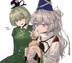  2girls ast.rockett black_headwear blue_eyes blue_headwear breasts commentary dress food food_on_face green_dress green_eyes grey_hair hat highres holding holding_food japanese_clothes juliet_sleeves kariginu korean_text long_hair long_sleeves mononobe_no_futo multiple_girls pom_pom_(clothes) ponytail puffy_sleeves ribbon-trimmed_sleeves ribbon_trim simple_background soga_no_tojiko tate_eboshi touhou translation_request white_background 