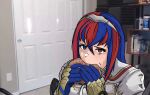  1girl alear_(female)_(fire_emblem) alear_(fire_emblem) blue_eyes blue_gloves blue_hair burger chriiis commentary door eating english_commentary fire_emblem fire_emblem_engage food gloves hair_between_eyes hairband heterochromia highres holding holding_food indoors jerma985 long_hair multicolored_hair photo_background real_life red_eyes red_hair shirt solo streaked_hair two-tone_hair upper_body white_shirt 