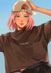  1girl absurdres artist_name backwards_hat baseball_cap black_pants blue_background blush brown_shirt character_name facial_mark forehead_mark green_eyes grey_headwear hand_on_own_head haruno_sakura hat highres looking_at_viewer medium_hair meoowwxx midriff_peek naruto_(series) pants parted_bangs parted_lips pink_hair shirt solo t-shirt upper_body 