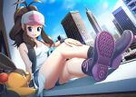  1girl :d antenna_hair arm_support bare_legs baseball_cap black_socks black_vest blue_eyes boots breasts brown_hair building city crossed_legs day eyelashes hat hilda_(pokemon) knees long_hair open_clothes open_mouth open_vest outdoors pokemon pokemon_(creature) pokemon_(game) pokemon_bw saitou_teikoku shirt shorts sidelocks sitting sky sleeveless sleeveless_shirt smile socks teeth tepig upper_teeth_only vest white_headwear white_shirt 