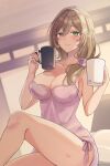  1girl absurdres breasts brown_hair camisole cleavage commentary_request cup feet_out_of_frame genshin_impact green_eyes highres holding holding_cup indoors large_breasts lisa_(genshin_impact) long_hair looking_at_viewer morimiya_(mori) mug no_headwear sitting smile solo spaghetti_strap thighs 
