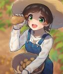  1girl blue_overalls blurry blurry_background blush bowl brown_hair dirty dirty_face food green_eyes hat holding holding_bowl holding_food holding_vegetable idolmaster idolmaster_million_live! kamille_(vcx68) kinoshita_hinata looking_at_viewer outdoors overalls potato shirt smile solo straw_hat teeth upper_teeth_only vegetable white_shirt work_gloves 