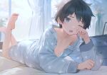  1boy :o barefoot bishounen black_hair blue_eyes blue_pajamas blue_shorts blush buttons chest_of_drawers cocolo_(co_co_lo) collarbone collared_shirt commentary_request curtains dot_nose feet feet_up flower full_body indoors long_sleeves looking_at_viewer lying male_focus on_bed on_stomach one_eye_closed open_clothes open_mouth open_shirt original pajamas raised_eyebrows rubbing_eyes shirt short_hair shorts sleepy soles solo toes vase window yellow_flower 