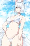  1girl absurdres animal_ear_fluff animal_ears azur_lane bare_arms bare_shoulders bikini blue_eyes blue_sky blush bracelet breasts cleavage cloud cloudy_sky commentary cowboy_shot dated_commentary fox_ears fox_girl fox_tail hair_between_eyes hand_on_own_hip highres jewelry kaga_(azur_lane) kitsune large_breasts looking_at_viewer midriff multiple_tails navel print_bikini samip short_hair sky solo standing swimsuit tail thighs white_bikini white_hair 