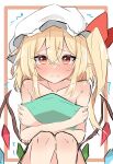  1girl blonde_hair blush commentary_request crossed_bangs crystal embarrassed feet_out_of_frame flandre_scarlet frown full-face_blush hair_between_eyes hat highres knees_together_feet_apart knees_up long_hair looking_at_viewer low_wings mob_cap nono54558 nude object_hug one_side_up pillow pillow_hug pointy_ears simple_background sitting solo straight-on touhou trembling wavy_mouth white_background wings 