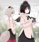  2girls animal_ears bare_shoulders bird_wings black_eyes black_hair black_skirt black_wings bright_pupils camera closed_mouth collared_shirt commentary detached_sleeves grass grey_hair hat highres holding holding_camera inubashiri_momiji looking_at_viewer multiple_girls one-hour_drawing_challenge outdoors red_eyes red_headwear red_skirt shameimaru_aya shirt short_hair skirt smile tail tohoyuukarin tokin_hat touhou two-tone_skirt white_pupils white_shirt wings wolf_ears wolf_girl wolf_tail 