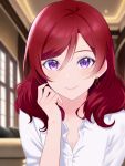  1girl blurry blurry_background breasts cleavage close-up closed_mouth commentary_request earrings highres indoors jewelry looking_at_viewer love_live! love_live!_school_idol_project medium_hair nishikino_maki purple_eyes red_hair shirt smile solo strawberryhat wavy_hair white_shirt 